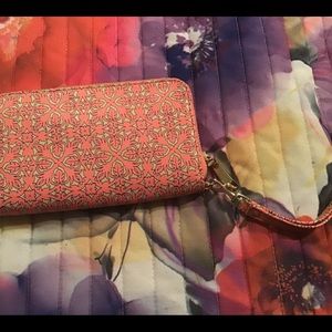 Cream and coral colored wrist wallet